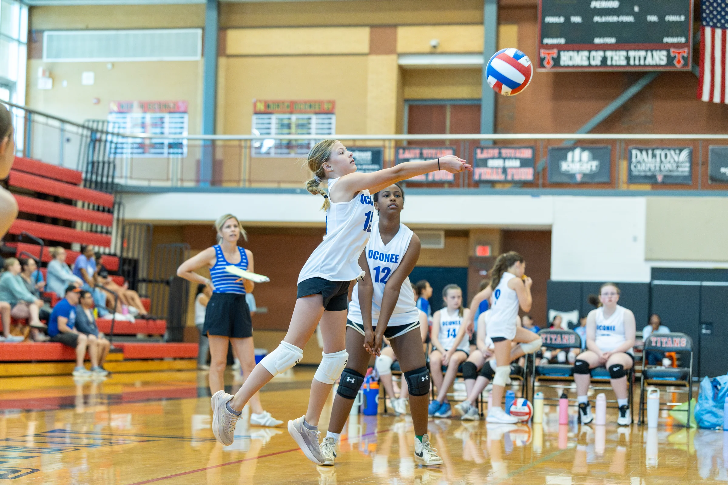 A player bumps a volleyball