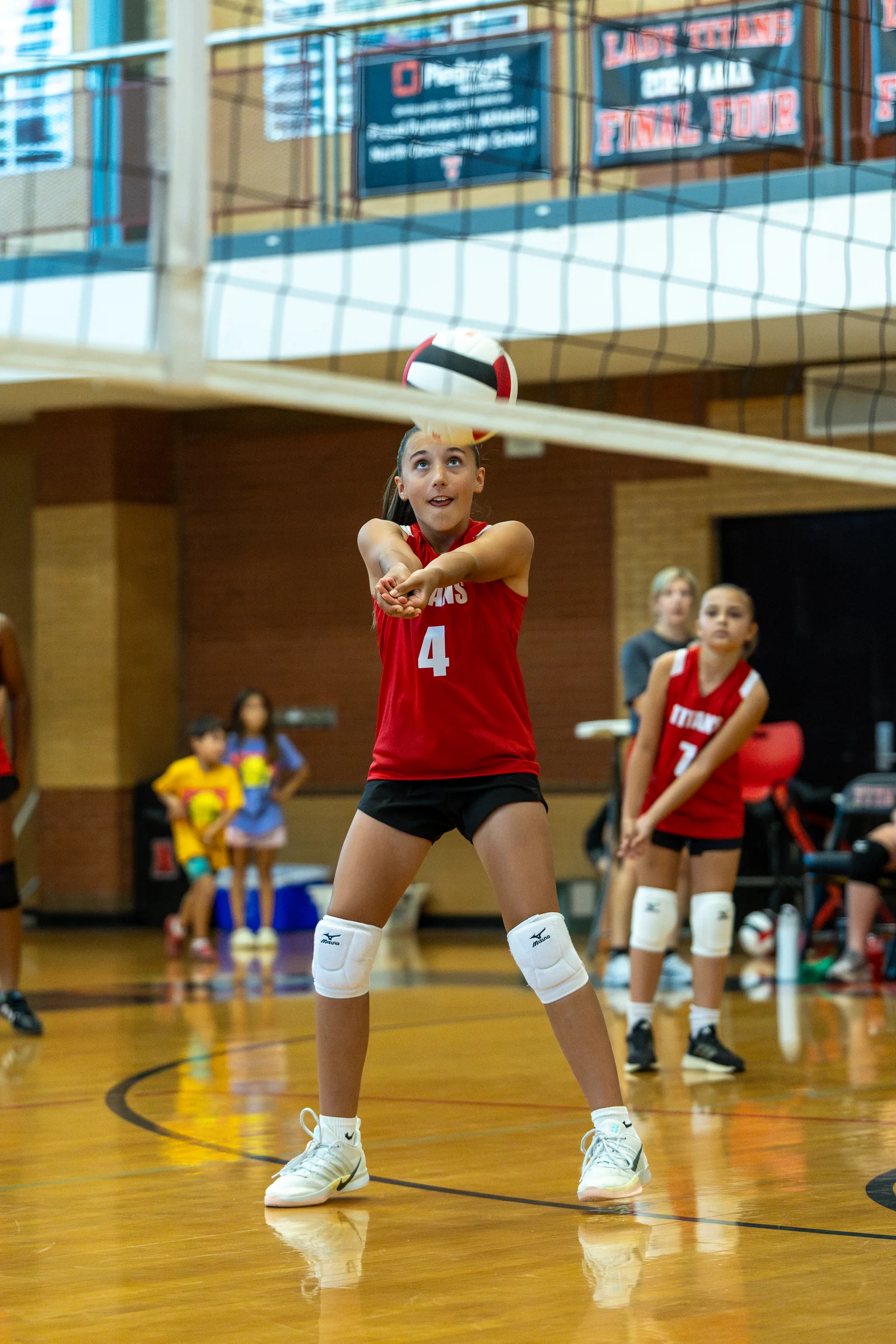 A player bumps a volleyball